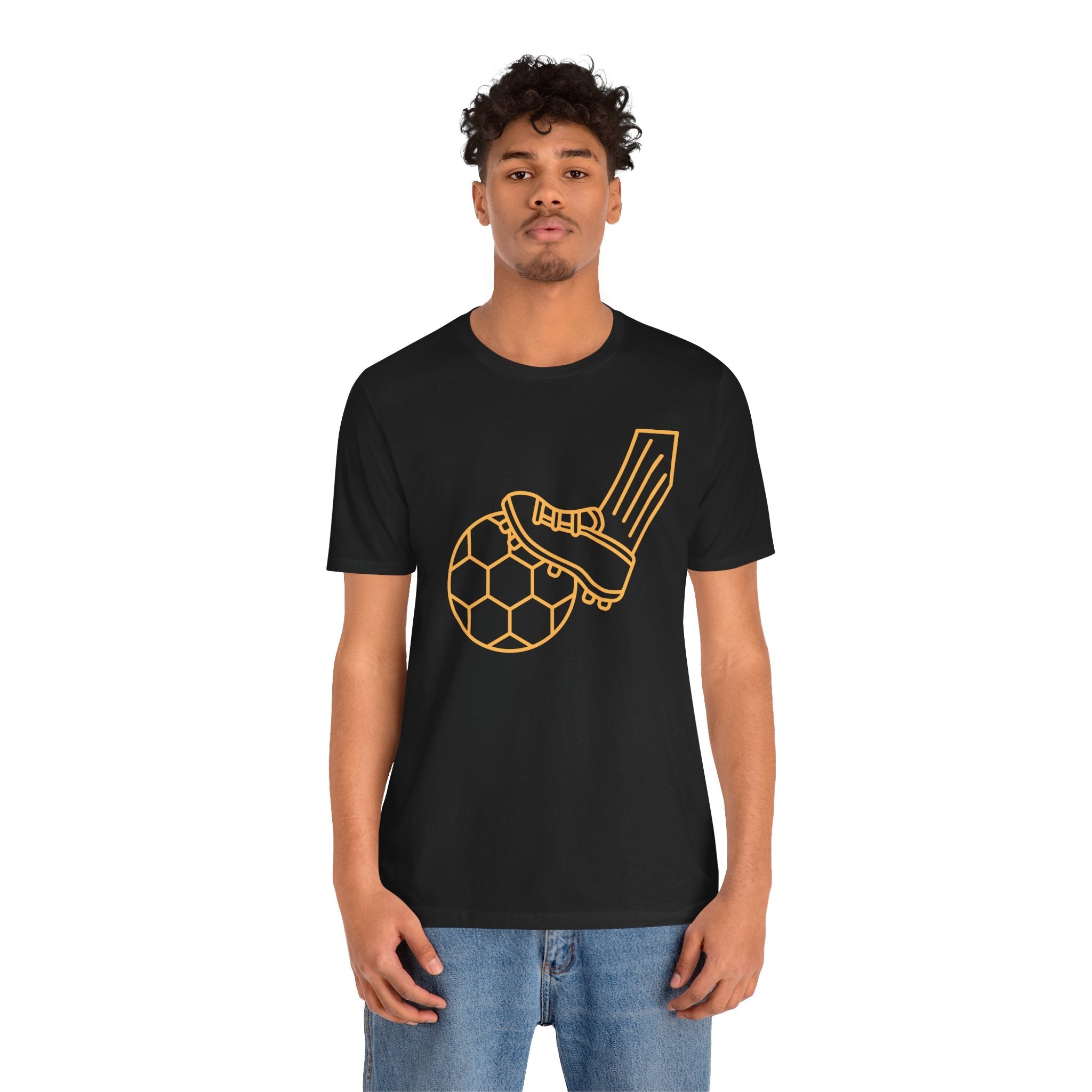 Black soccer t-shirt featuring a bold graphic of a soccer ball and a foot in a stylish design, perfect for fans.