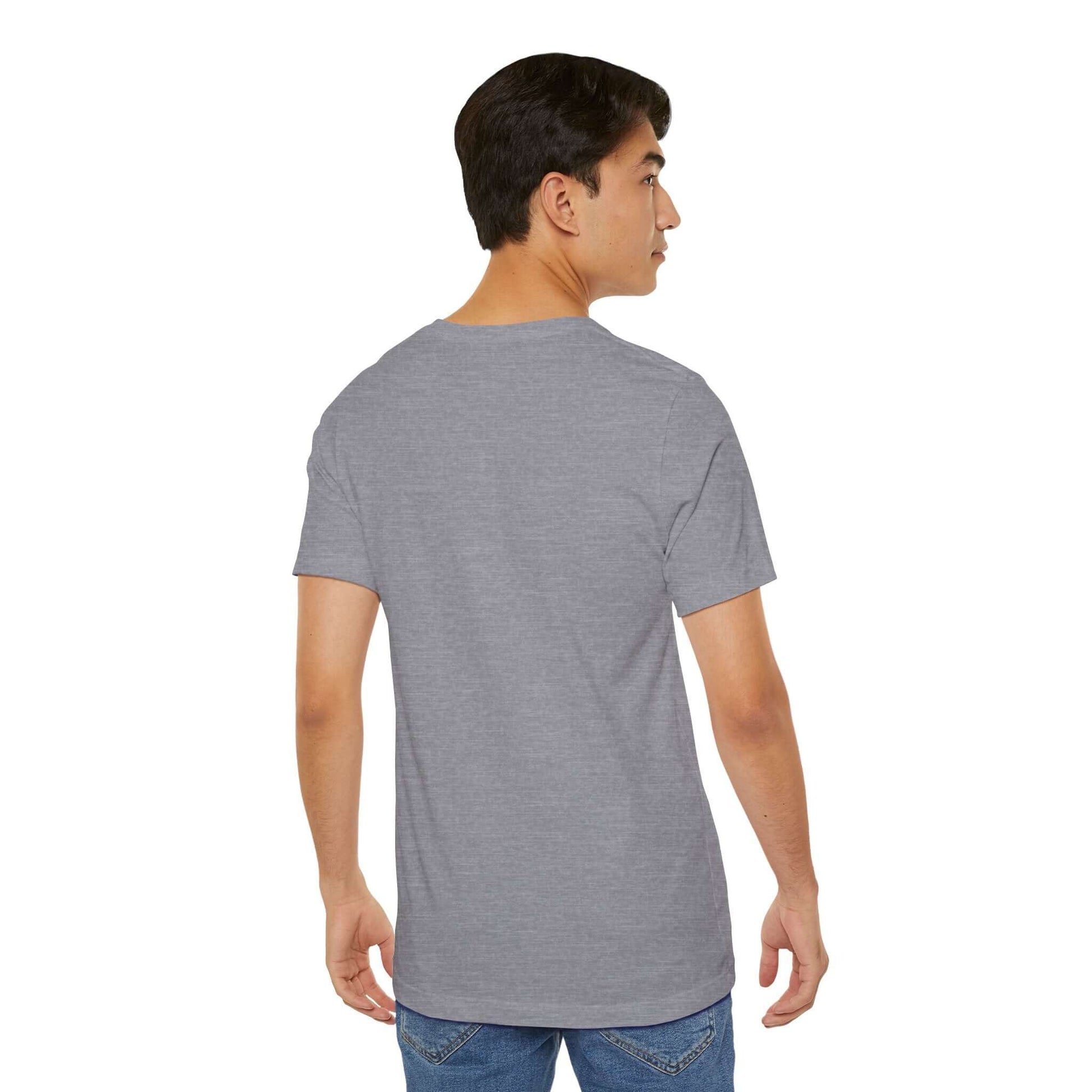 Back view of a young man wearing a gray graphic street style tee, showcasing trendy urban fashion.