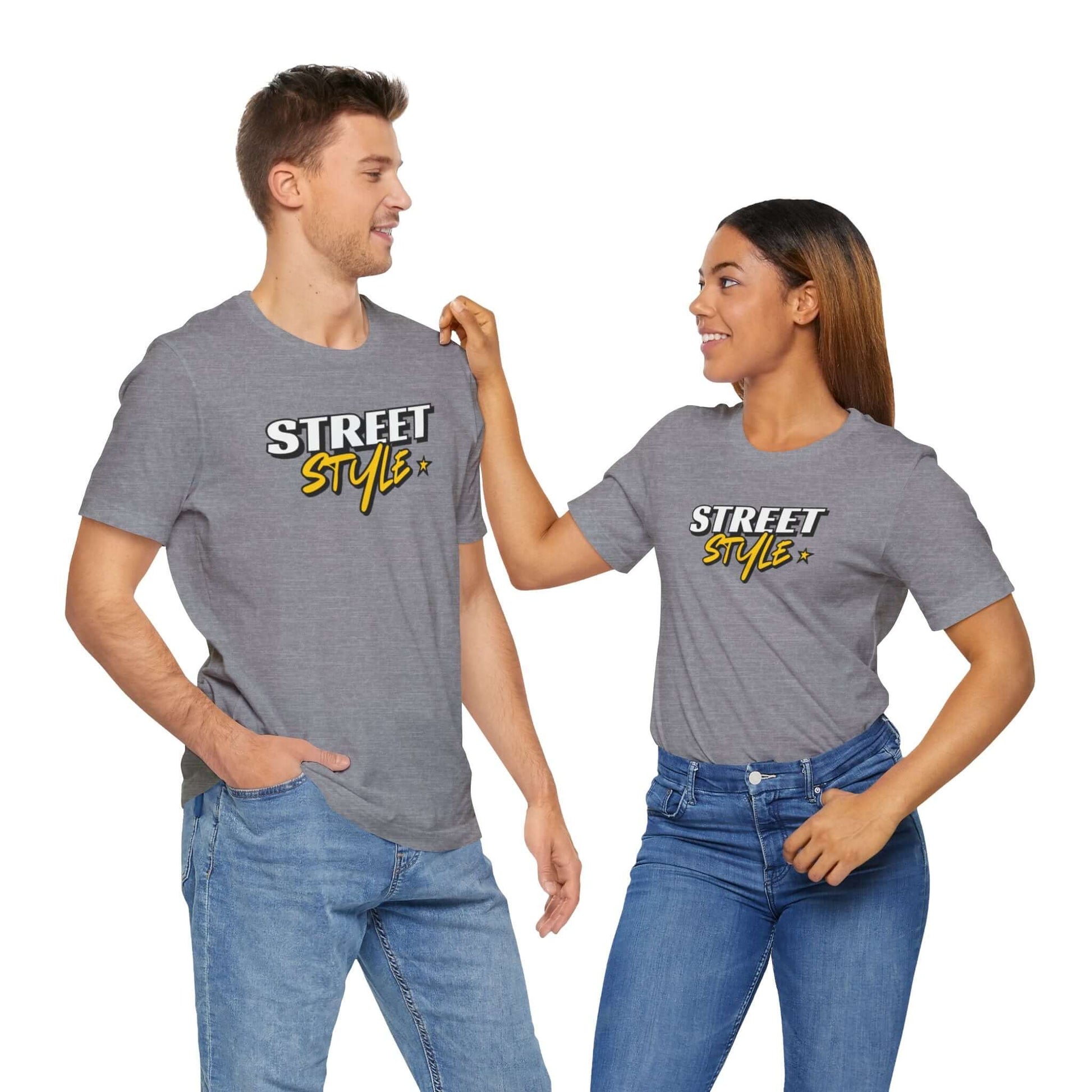 Unisex street style graphic tee showcased by a man and woman, perfect for trendy urban fashion.