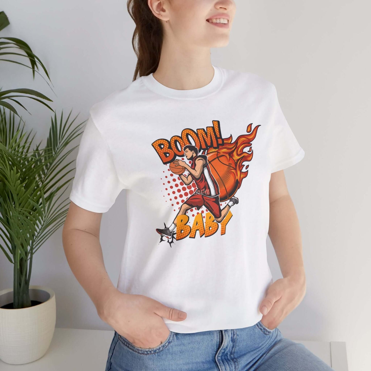 Model wearing a white Boom Baby Basketball Tee, featuring a graphic design and a casual streetwear style.