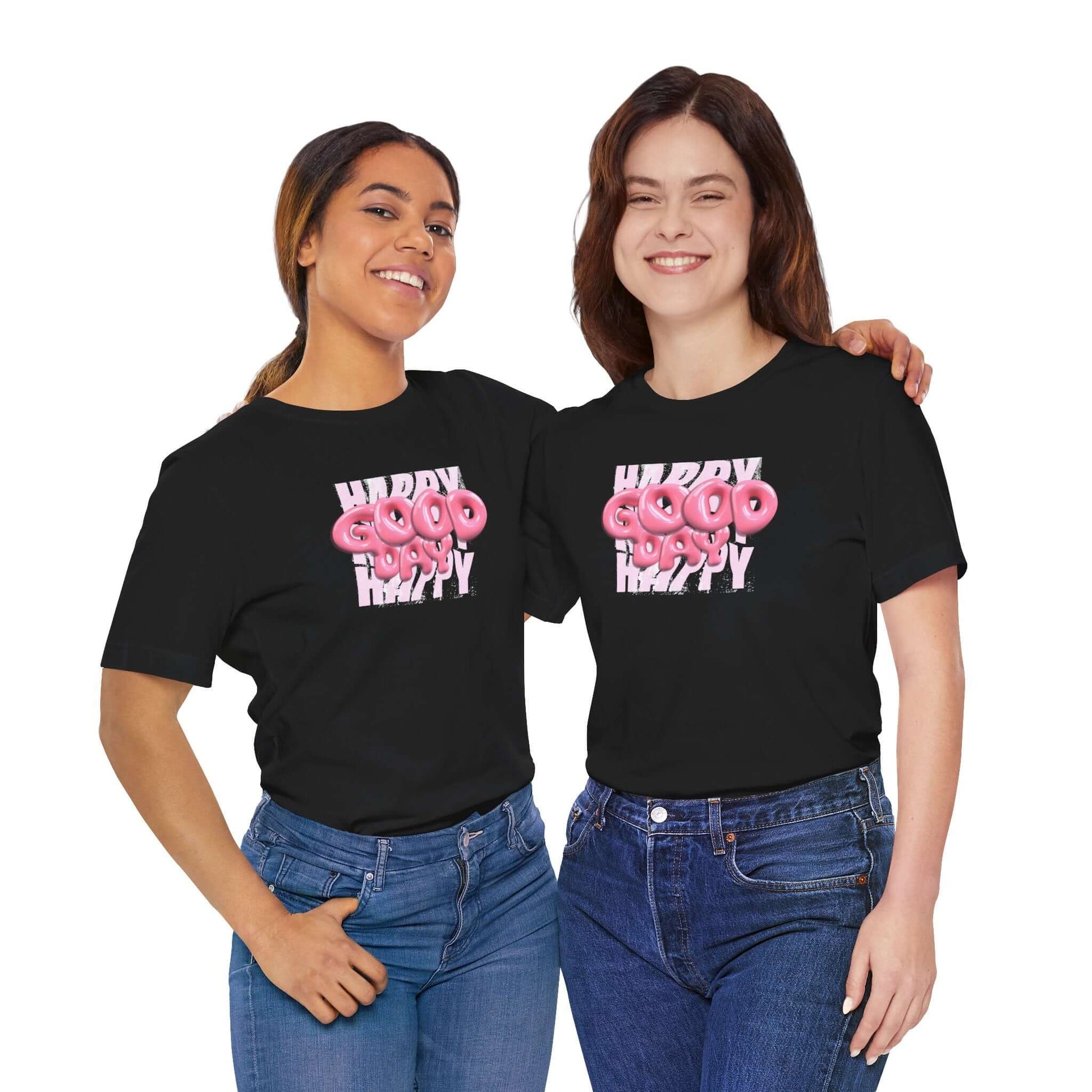 Two women wearing Happy Good Vibes graphic tees, showcasing a playful design for casual wear or gifts.
