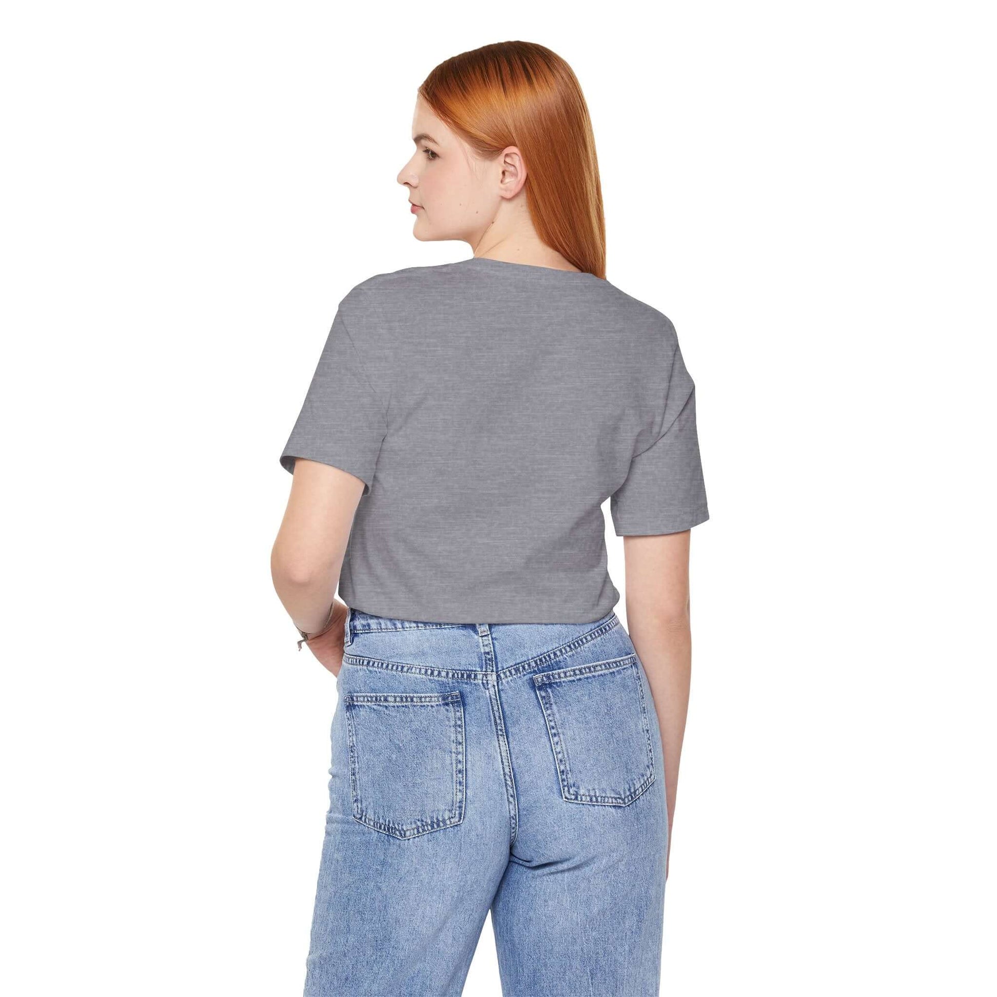 Back view of a woman in a gray Graphic Street Style Tee paired with light blue jeans.