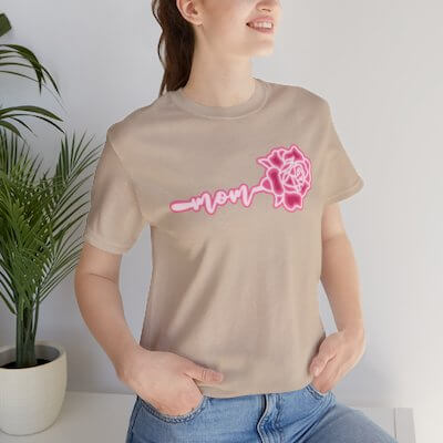 Mom t-shirt with pink rose design, celebrating Mother's Day in stylish beige color.