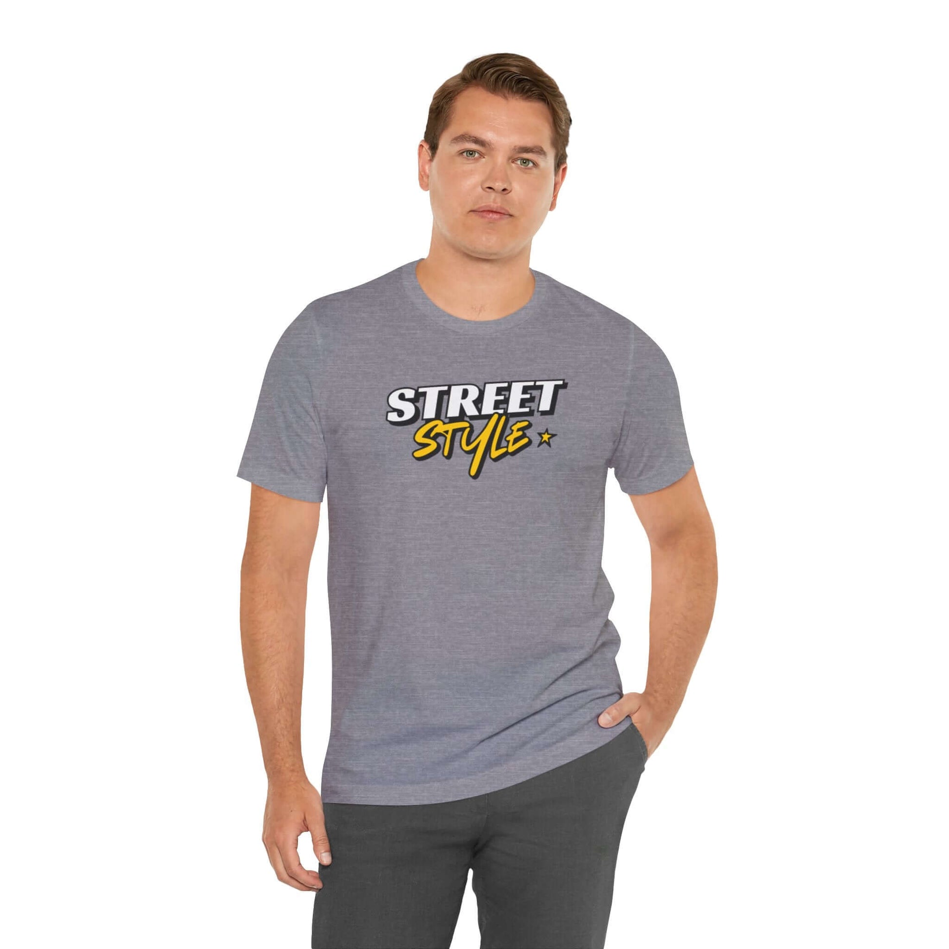 Man wearing graphic street style tee in gray, showcasing trendy urban fashion and casual wear.
