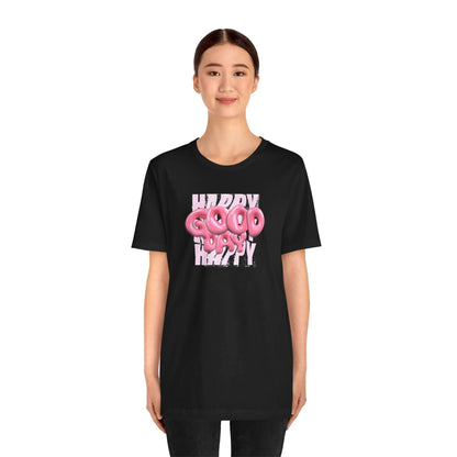 Model wearing a black Graphic Tee with a playful 'Happy Good Vibes' design, perfect for casual wear and parties.