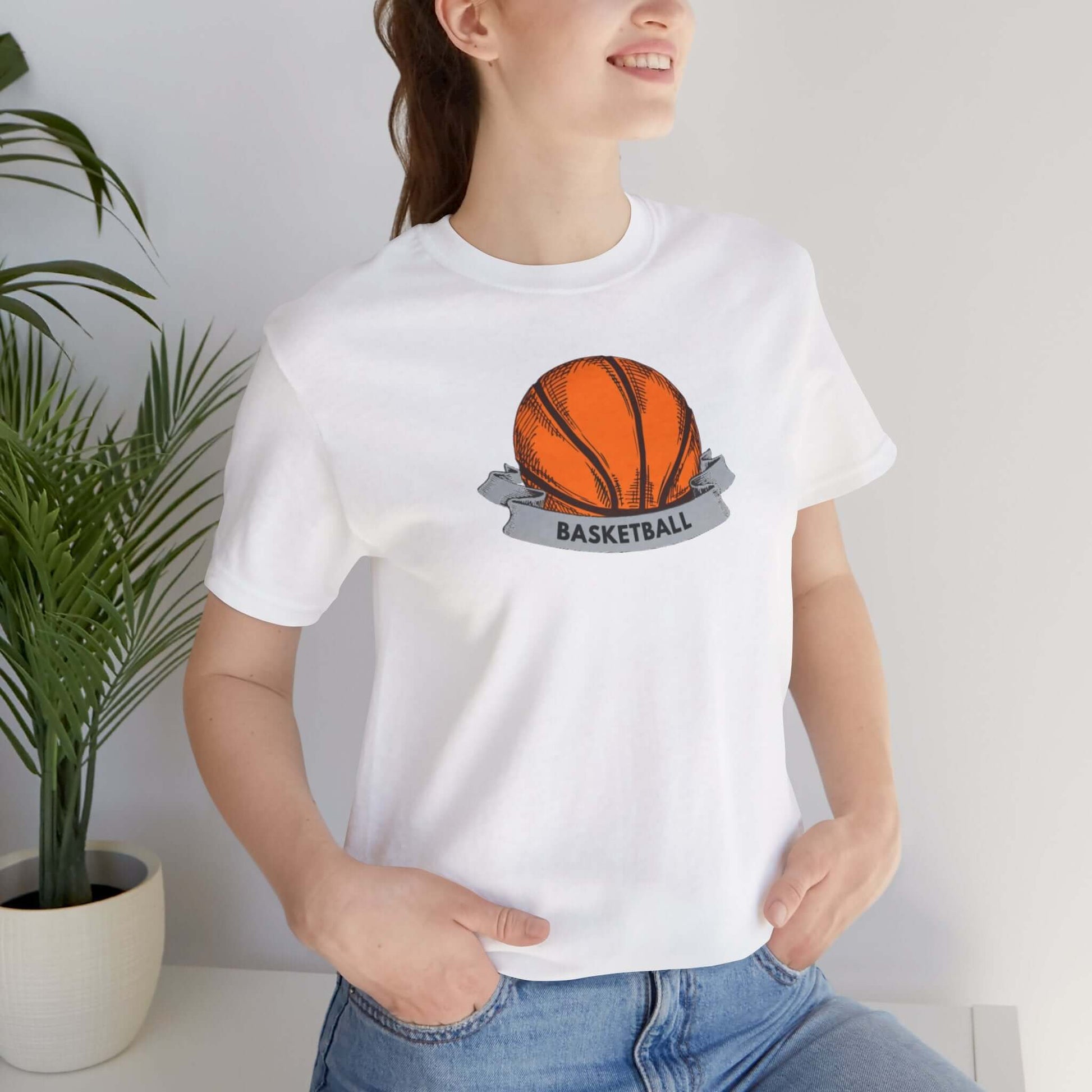 Woman wearing a Basketball Unisex Jersey Tee with a vibrant orange basketball graphic, perfect for sports enthusiasts.