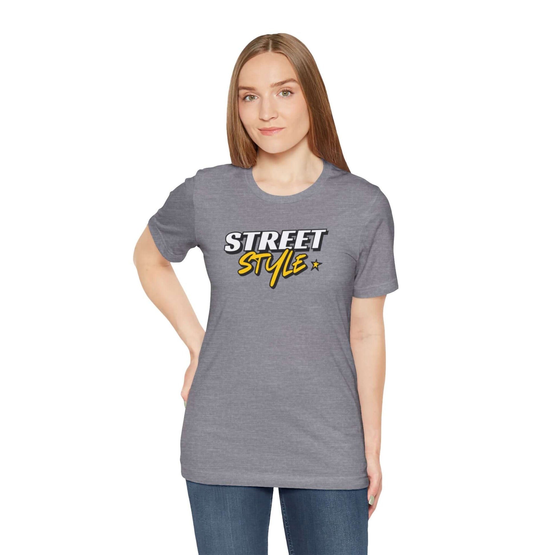 Model wearing a gray graphic street style tee, showcasing trendy urban fashion and casual wear.