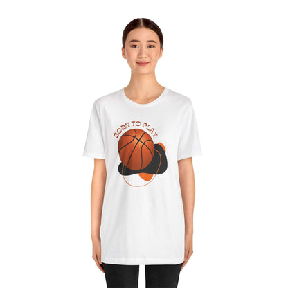 Model wearing a white unisex tee with 'Born to Play' graphic and basketball design, ideal for sports enthusiasts.